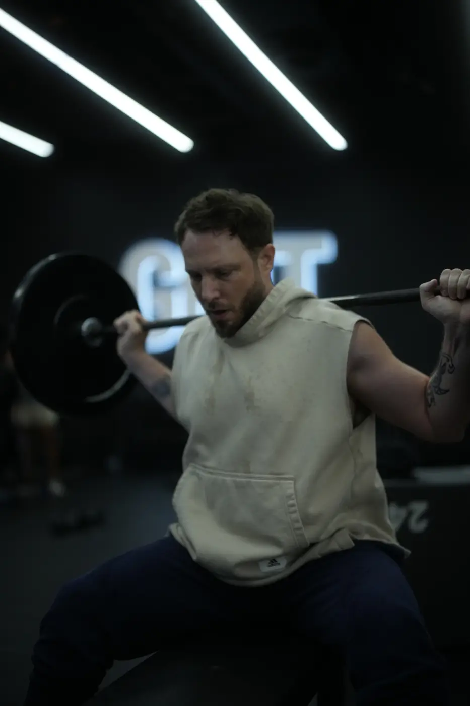 Athlete in a barbell squat at GRIT Studios