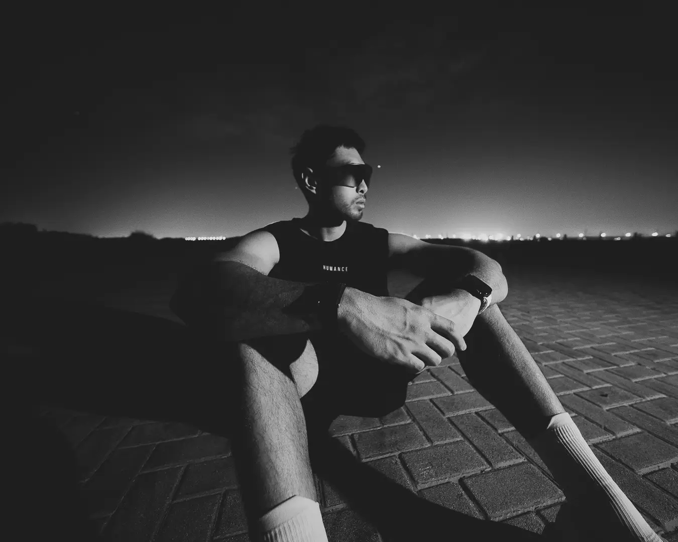Athlete resting on the ground after a night session