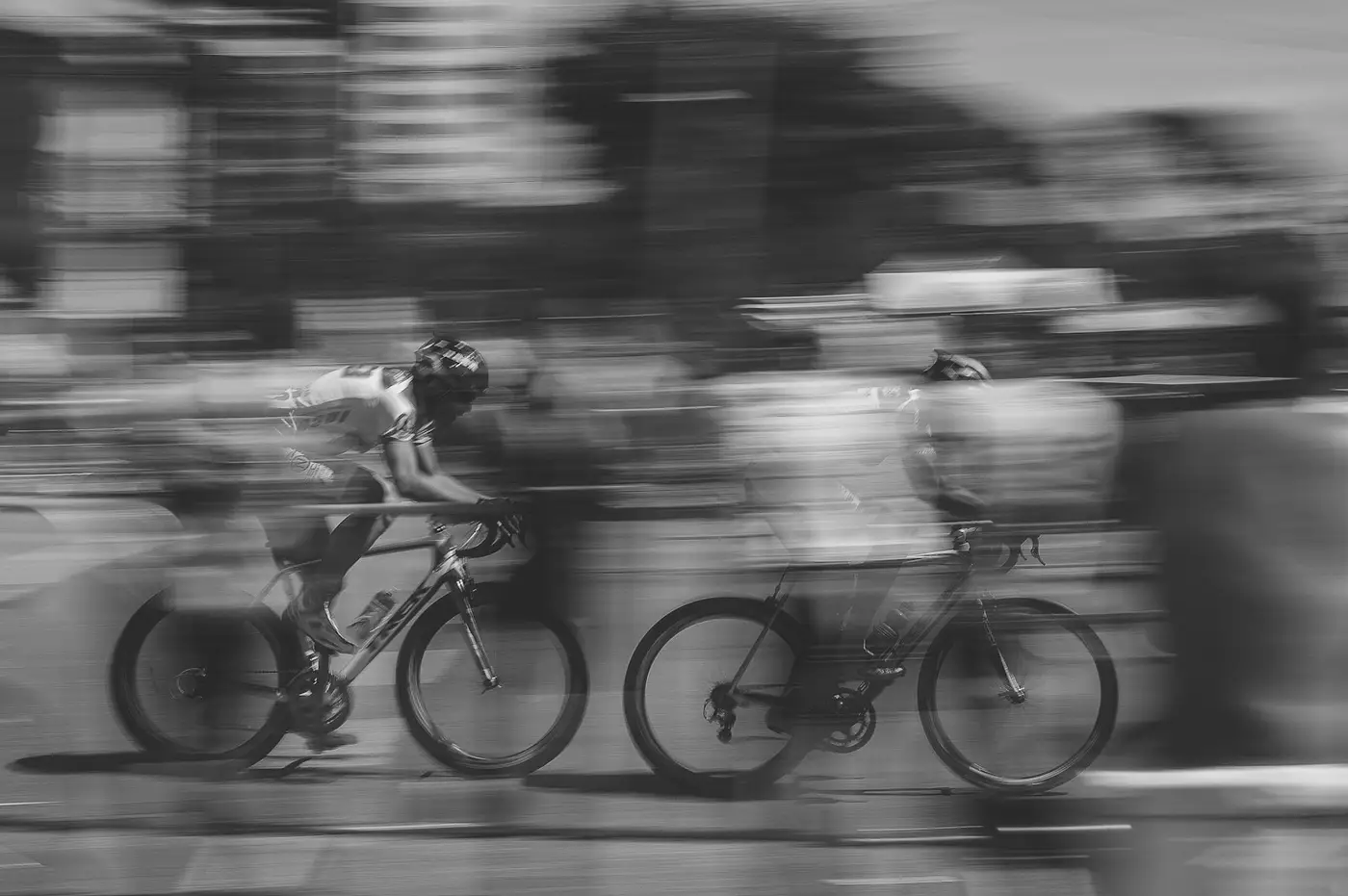 Two cyclists in motion blur