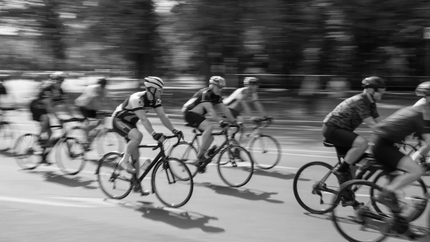 Cyclists racing on a road, panning blur