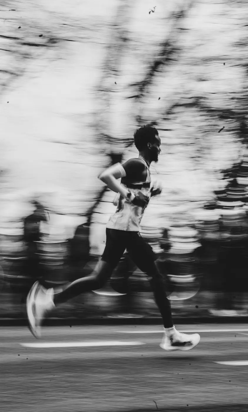 Runner mid-stride against a blurred background
